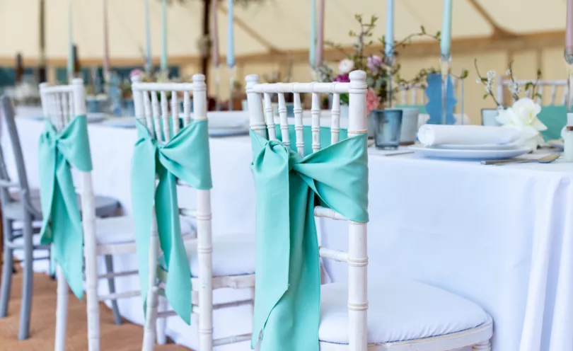 Sage Green chair sashes with Arctic White napkins and table cloths