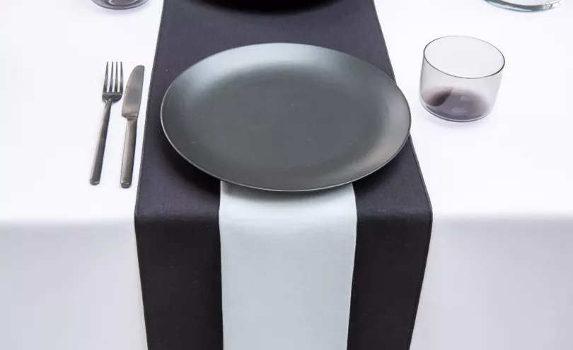Pebble Grey napkin with Jet Black table runners and Arctic White table cloths