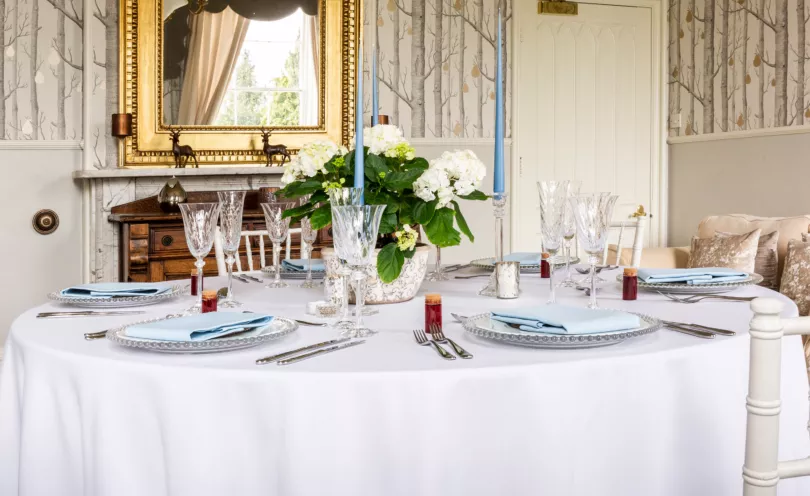 Cambridge Blue table linen napkins on a round Arctic White table cloth